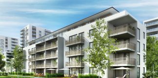 You're reading about six ways to invest in apartment buildings by Passive Income, MD. Pictured here is a modern apartment building, one example of a multifamily property.