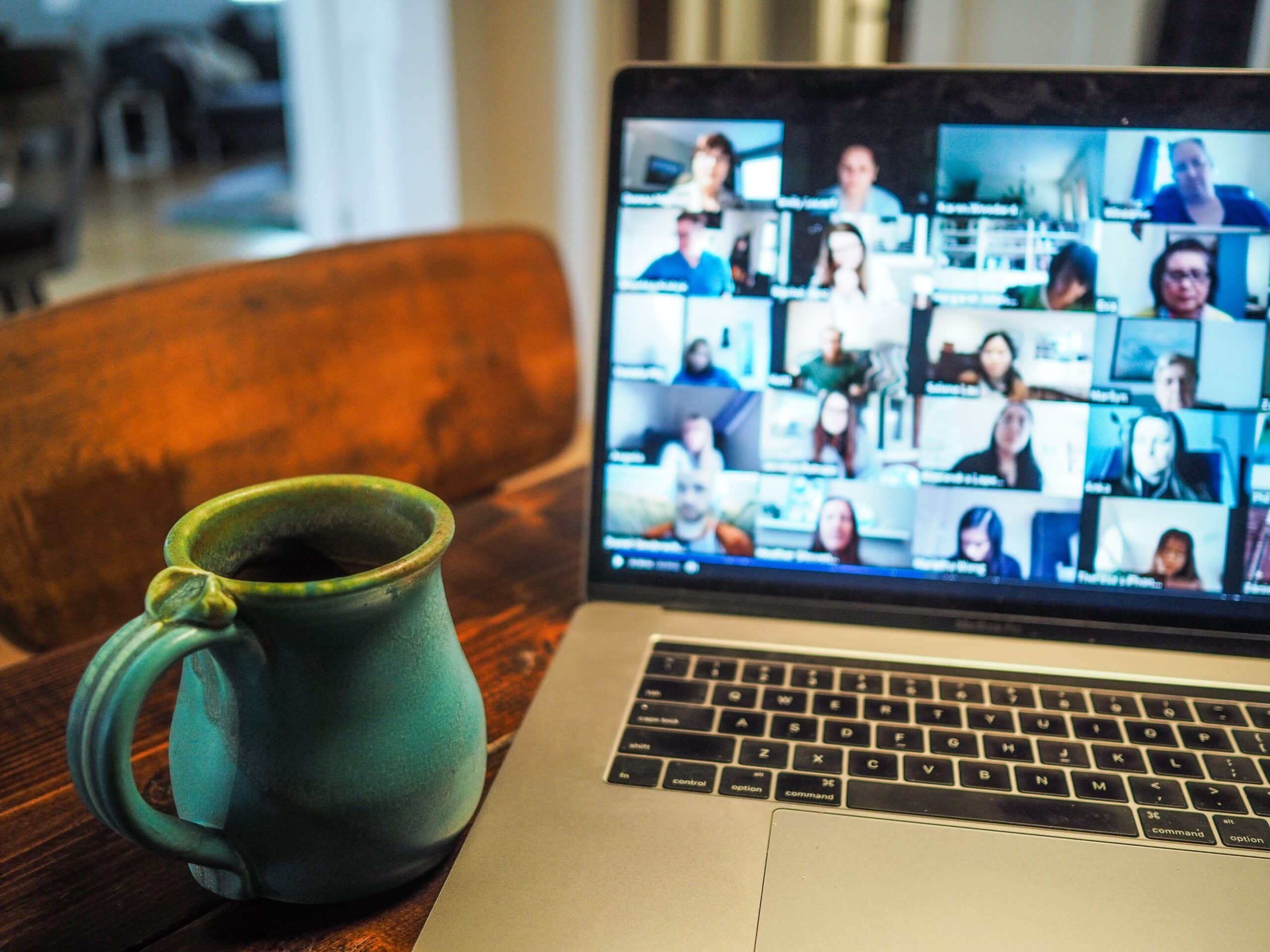 Computer with coffee mug next to it