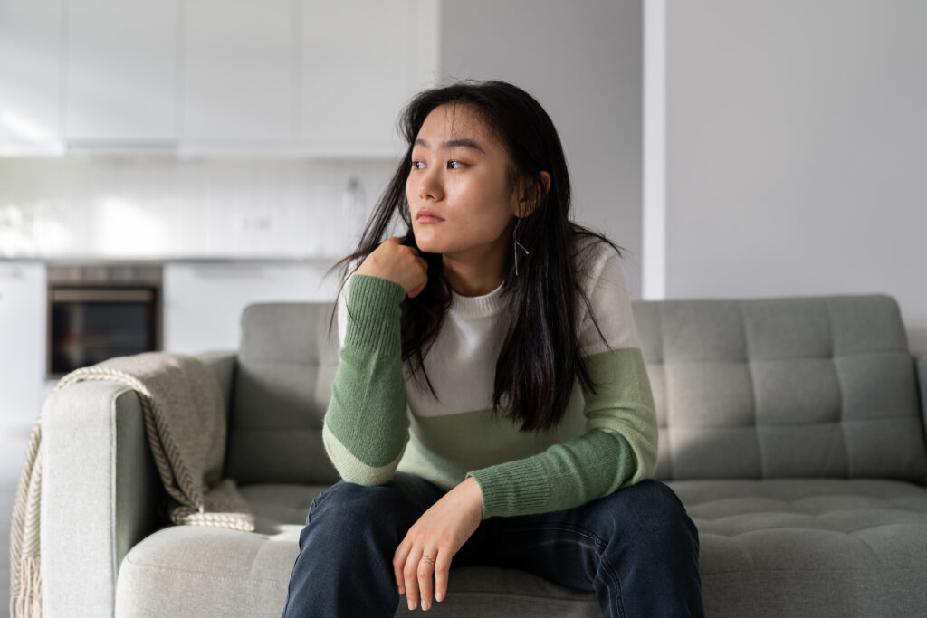 Sad woman contemplating if money really makes her happy